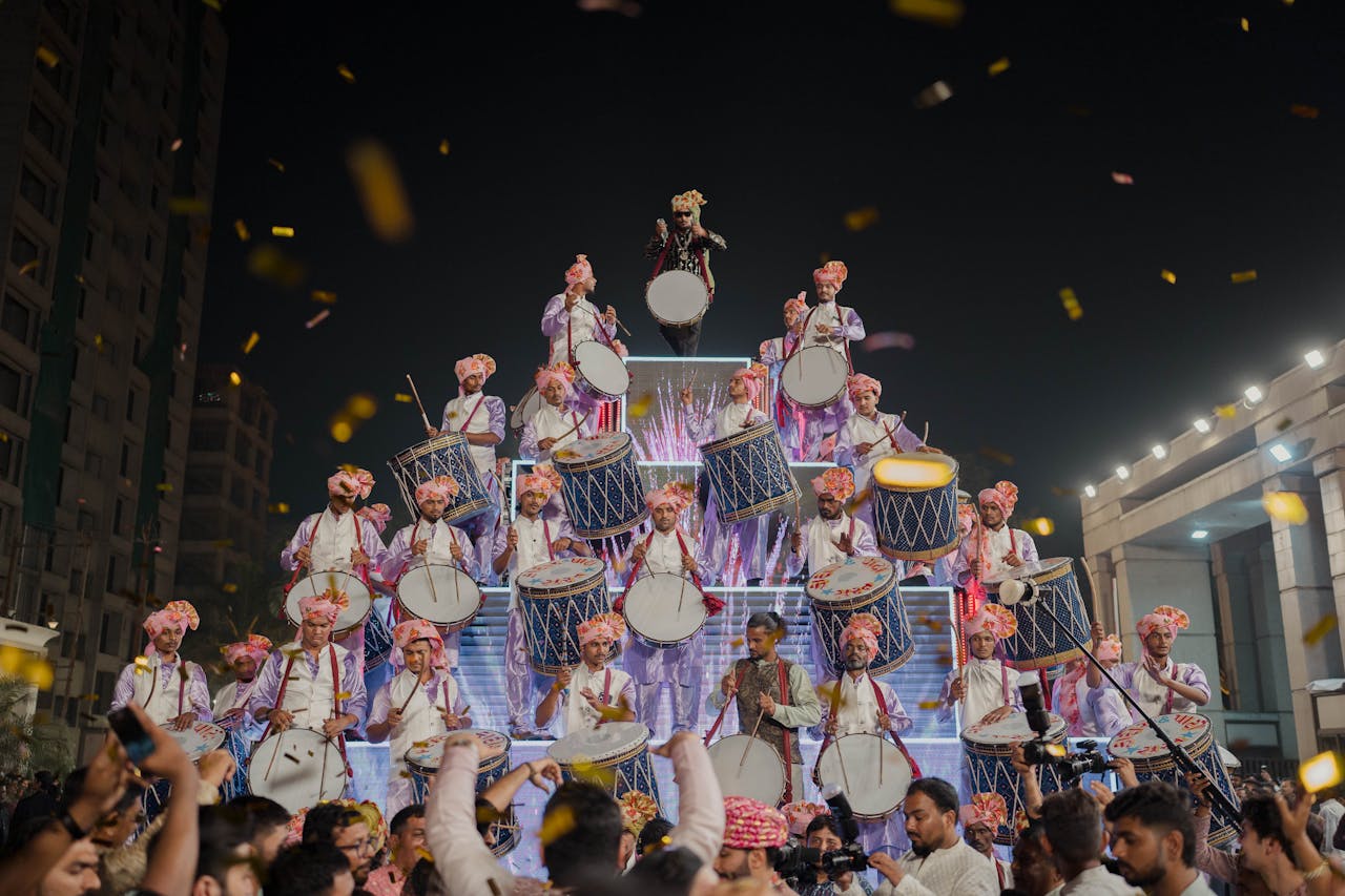 Vibrant night scene of a traditional Indian drum performance in Surat, Gujarat.