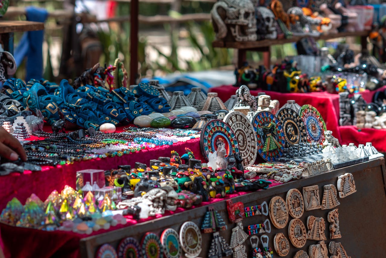 Vibrant display of handcrafted Mexican souvenirs at Chichén Itzá market, Yucatán.